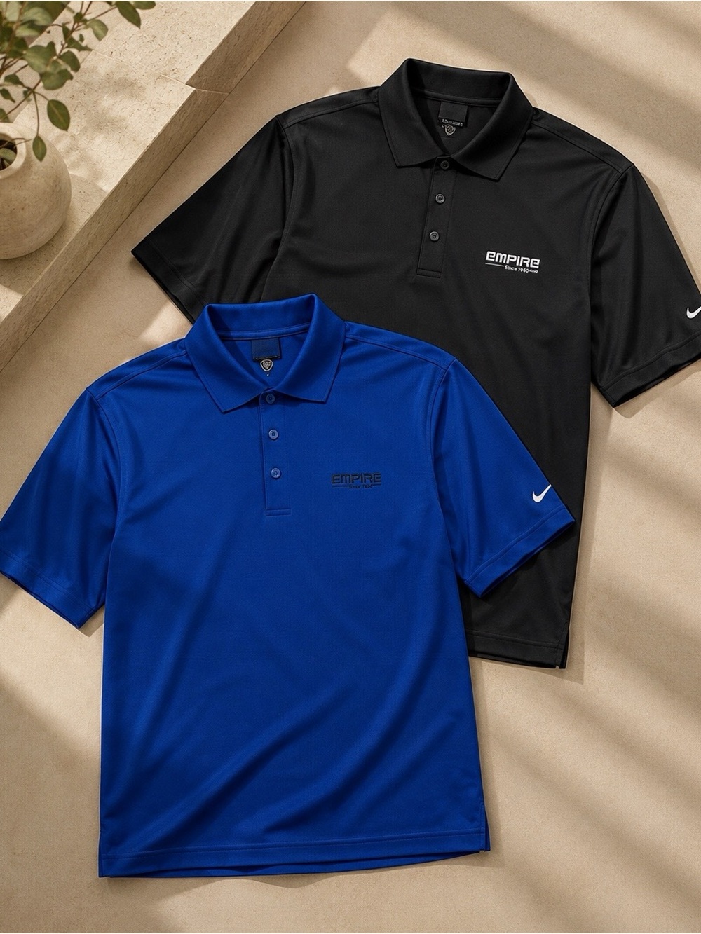 2 Nike Empire black and blue polo shirts